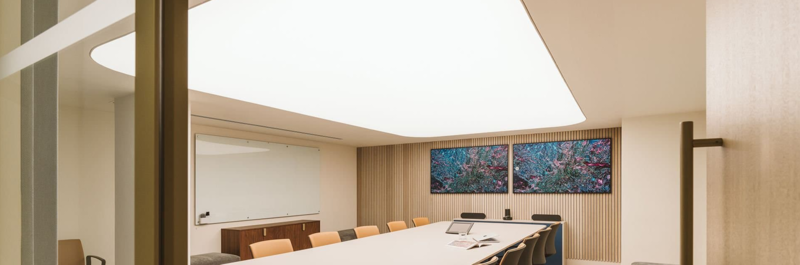 Bright meeting room with illuminated fabric ceilings