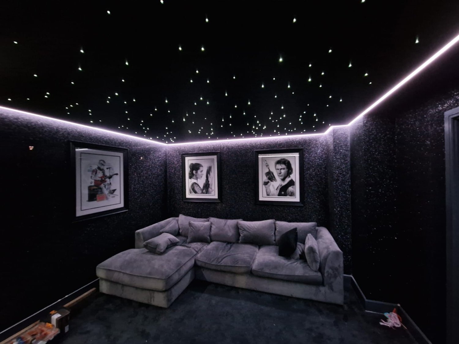 Dark room with star illuminated ceiling