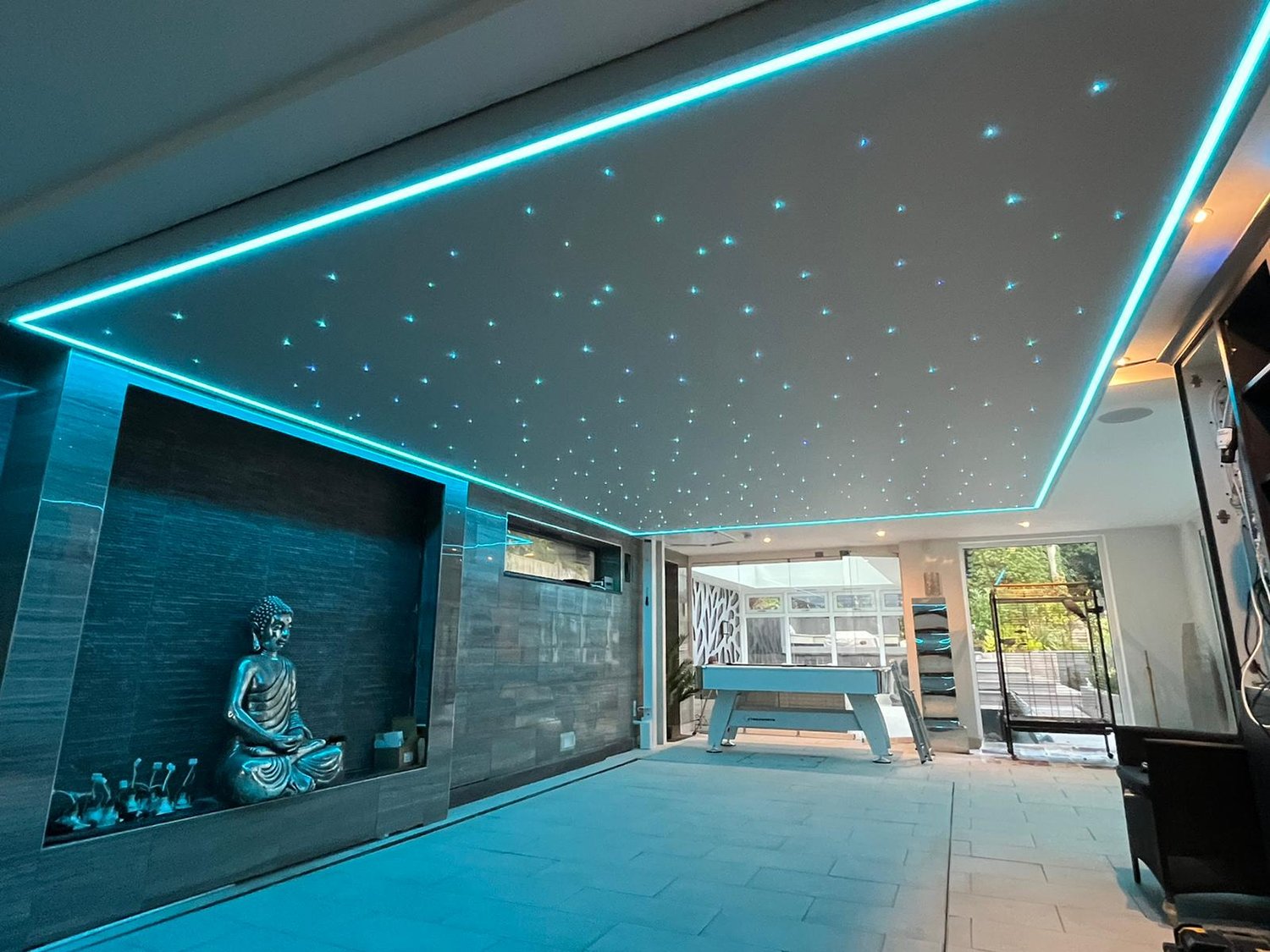 Room with illuminated stretch ceiling